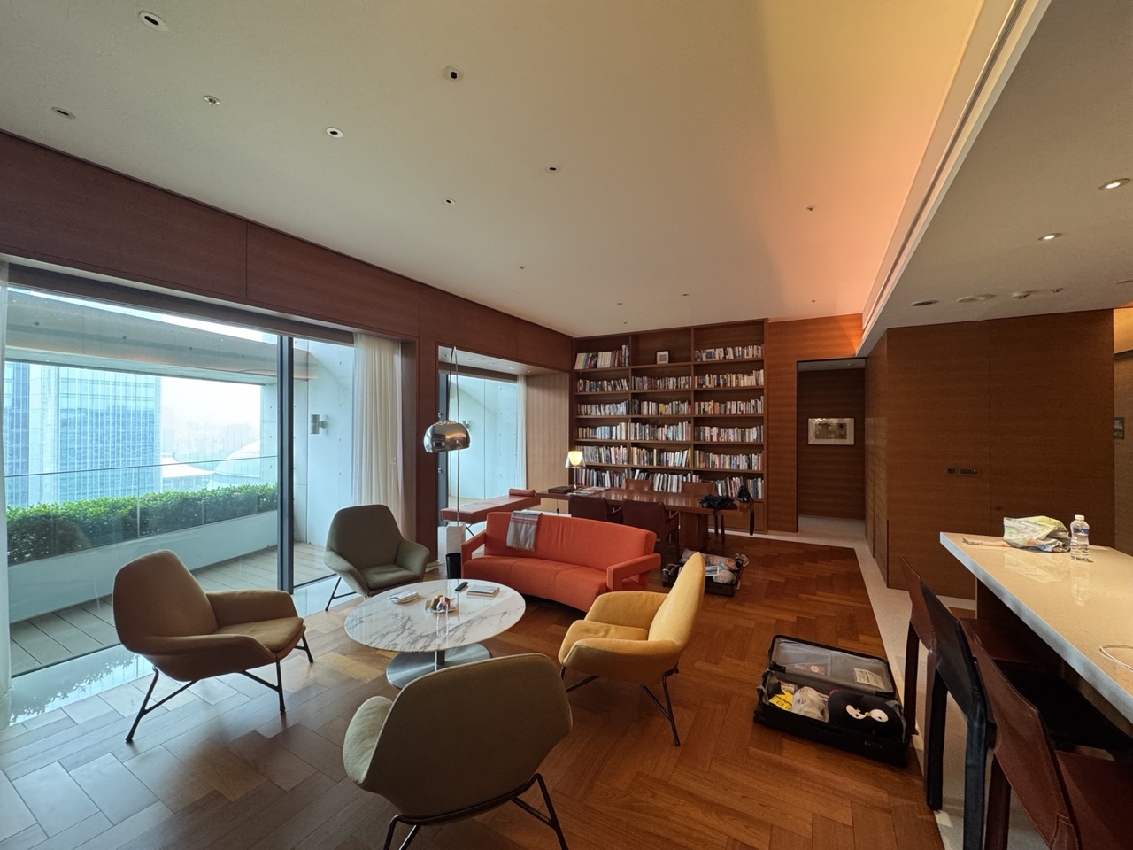 Eslite Library Suite with bookshelves, warm wood interiors, large windows and several reading chairs.
